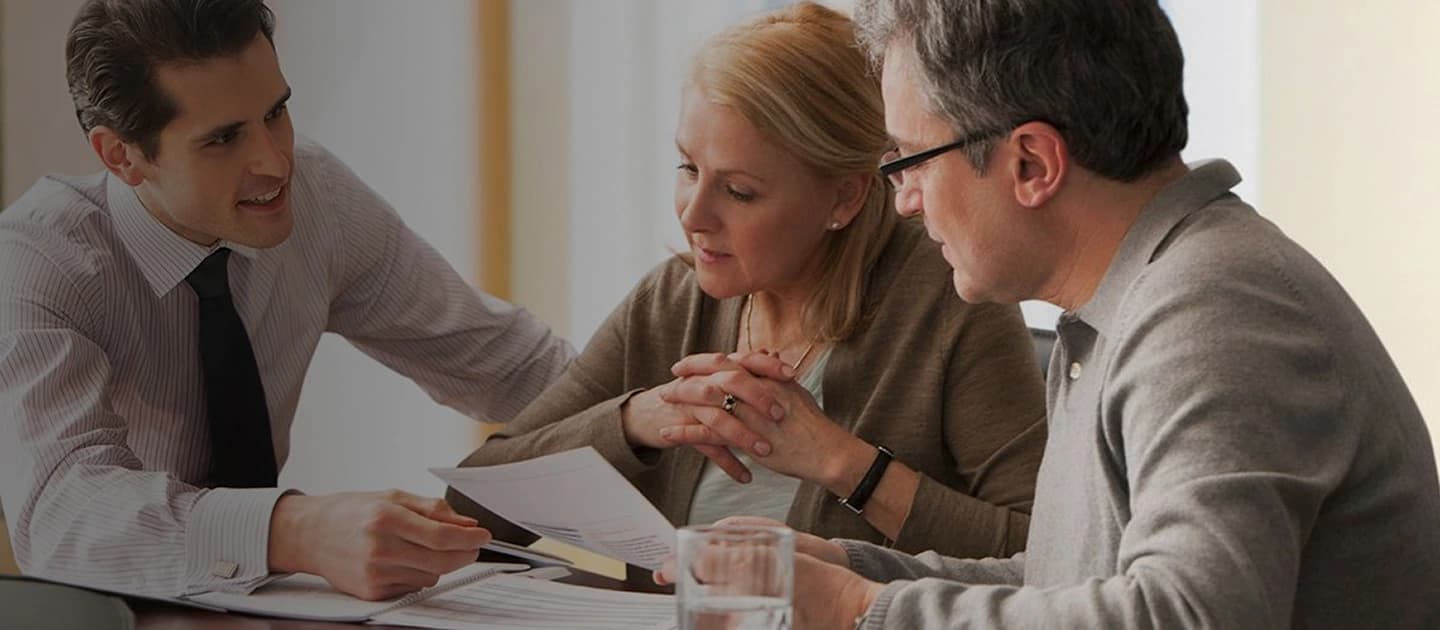 Mortgage consultants helping a couple secure their dream home